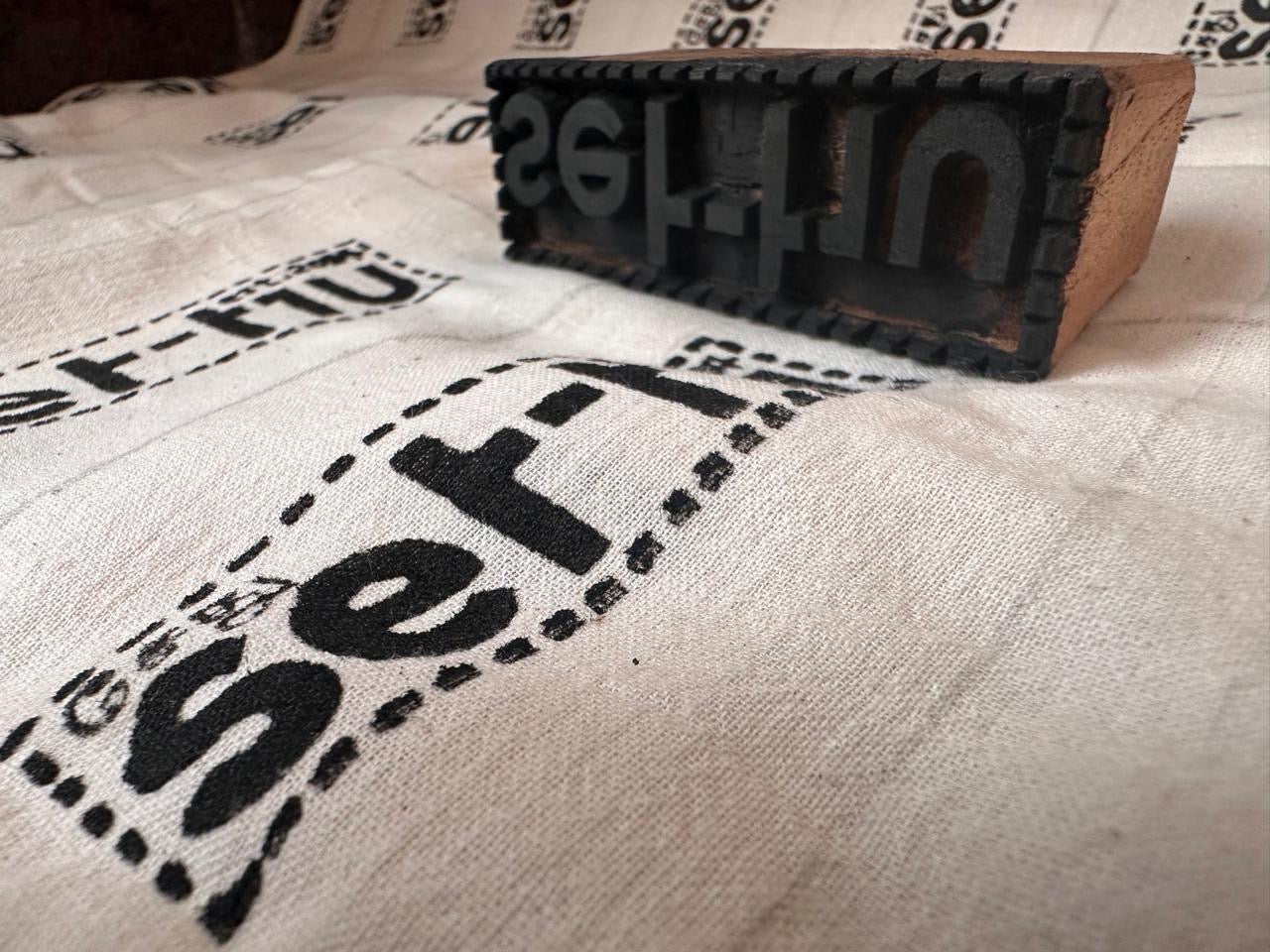 Sethu — about page hero (block print stamp on hand-printed cloth)